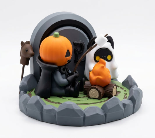 A Halloween-themed collectible figurine depicting a ghostly figure with a pumpkin head roasting an orange pumpkin on a stick next to a white ghost with a marshmallow on a stick, set on a circular stone base with a campfire and a horse head accessory.